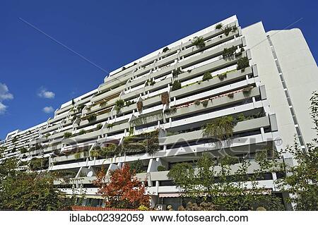 "A multistorey building with some plants on the concrete balconies, former Olympic Village, Munich, Bavaria, Germany, Europe" View Large Photo Image Stock Photo - "A multistorey building with some plants on the concrete balconies, former Olympic Village, Munich, Bavaria, Germany, Europe". Fotosearch