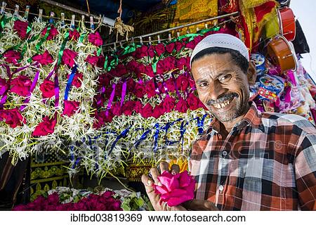 "A Muslim salesman is selling flowers, Mahalaksmi, Mumbai, Maharashtra, India, Asia" View Large Photo Image Stock Photo - "A Muslim salesman is selling flowers, Mahalaksmi, Mumbai, Maharashtra, India, Asia". Fotosearch