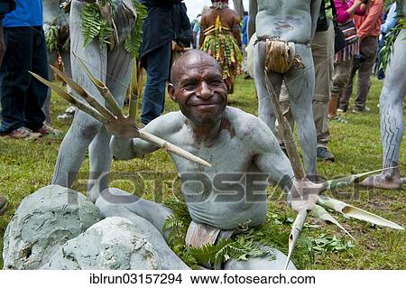 "A painted man is celebrating at the traditional Sing Sing gathering in the highlands, Paya, Papua New Guinea, Oceania" View Large Photo Image Picture - "A painted man is celebrating at the traditional Sing Sing gathering in the highlands, Paya, Papua New Guinea, Oceania". Fotosearch