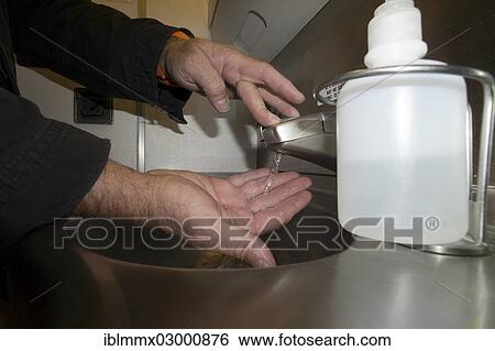 "A passenger washing his hands in the lavatory of an airplane, Boeing 777" View Large Photo Image Stock Photograph - "A passenger washing his hands in the lavatory of an airplane, Boeing 777". Fotosearch