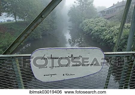Stock Photograph - "A quotation by poet A. Chekhov on a bridge over the Coney river, Fontenoy-le-Chateau, Epinal, Lorraine, Departement Vosges, France, Europe". Fotosearch