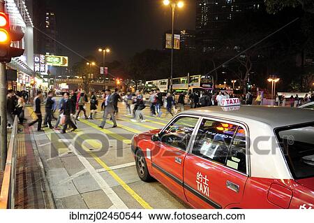 "A red taxi waiting at a zebra crossing on Chatham Road in the evening, Tsim Sha Tsui, Kowloon, Hong Kong, China, Asia" View Large Photo Image Picture - "A red taxi waiting at a zebra crossing on Chatham Road in the evening, Tsim Sha Tsui, Kowloon, Hong Kong, China, Asia". Fotosearch