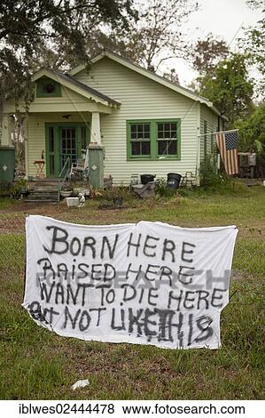 Stock Photo - "A resident's a homemade sign displays frustration after the small town of Jean Lafitte was flooded by Hurricane Isaac, Jean Lafitte, Louisiana, USA". Fotosearch