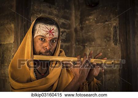"A sadhu playing a flute, Pashupatinath, Kathmandu, Kathmandu District, Bagmati Zone, Nepal, Asia" View Large Photo Image Stock Photography - "A sadhu playing a flute, Pashupatinath, Kathmandu, Kathmandu District, Bagmati Zone, Nepal, Asia". Fotosearch
