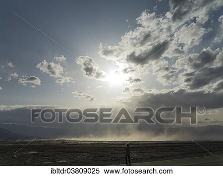 Stock Photography - "A sand storm over the Mesquite Flat Sand Dunes and the Panamint Range in the evening, Death Valley, Death Valley National Park, California, USA". Fotosearch