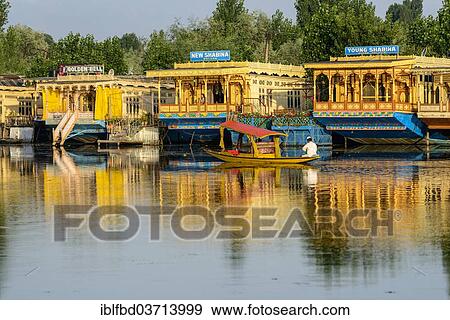 "A shikara boat on Dal Lake, houseboats at the back, Srinagar, Jammu and Kashmir, India, Asia" View Large Photo Image Stock Photo - "A shikara boat on Dal Lake, houseboats at the back, Srinagar, Jammu and Kashmir, India, Asia". Fotosearch