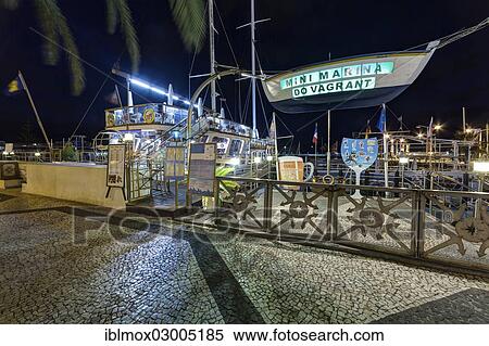 "A ship converted into a restaurant on the promenade, port of Funchal, Santa Luzia, Funchal, Madeira, Portugal, Europe" View Large Photo Image Stock Photography - "A ship converted into a restaurant on the promenade, port of Funchal, Santa Luzia, Funchal, Madeira, Portugal, Europe". Fotosearch