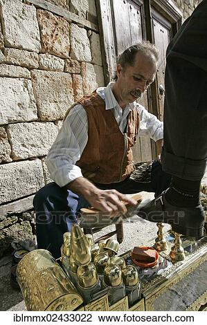 "A shoe polisher cleaning a woman's shoe, historic district, Alanya, Turkey, Asia" View Large Photo Image Stock Image - "A shoe polisher cleaning a woman's shoe, historic district, Alanya, Turkey, Asia". Fotosearch