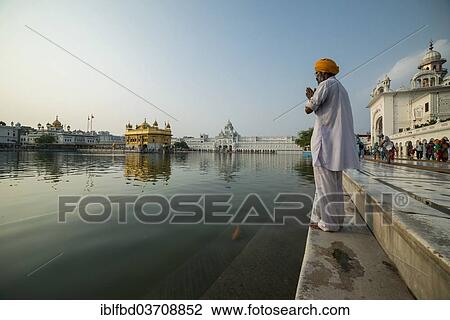 "A Sikh devotee praying at the holy pool of the Harmandir Sahib or Golden Temple, a holy Sikh temple, Amritsar, Punjab, India, Asia" View Large Photo Image Stock Image - "A Sikh devotee praying at the holy pool of the Harmandir Sahib or Golden Temple, a holy Sikh temple, Amritsar, Punjab, India, Asia". Fotosearch