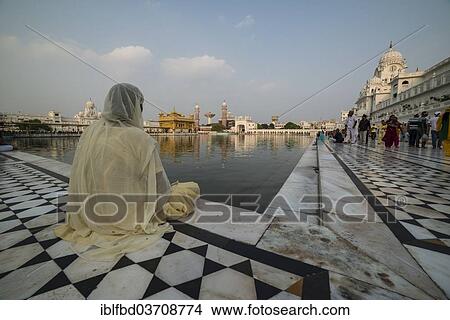 "A Sikh devotee sitting at the holy pool, Harmandir Sahib or Golden Temple, a holy Sikh temple, Amritsar, Punjab, India, Asia" View Large Photo Image Picture - "A Sikh devotee sitting at the holy pool, Harmandir Sahib or Golden Temple, a holy Sikh temple, Amritsar, Punjab, India, Asia". Fotosearch