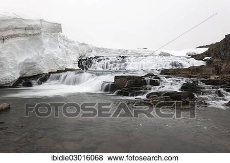 "A small waterfall under a thick layer of ice, Nordwest Halbinsel, Iceland, Europe" View Large Photo Image Stock Photo - "A small waterfall under a thick layer of ice, Nordwest Halbinsel, Iceland, Europe". Fotosearch