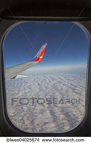 "A Southwest Airlines plane flies above Nebraska, USA" View Large Photo Image Picture - "A Southwest Airlines plane flies above Nebraska, USA". Fotosearch