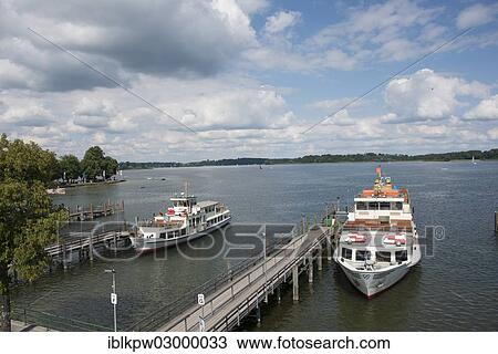 "A steamboat at a landing stage on lake Chiemsee, Insel Herrenchiemsee, Prien am Chiemsee, Bavaria, Germany, Europe" View Large Photo Image Stock Image - "A steamboat at a landing stage on lake Chiemsee, Insel Herrenchiemsee, Prien am Chiemsee, Bavaria, Germany, Europe". Fotosearch