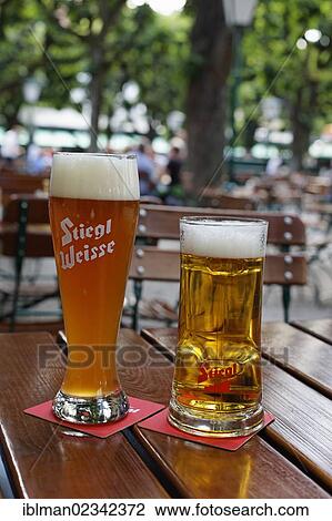 "A Stiegl wheat beer and a lager beer, Stieglbraeu zum Klosterhof beer garden, Linz, Upper Austria, Austria, Europe" View Large Photo Image Stock Image - "A Stiegl wheat beer and a lager beer, Stieglbraeu zum Klosterhof beer garden, Linz, Upper Austria, Austria, Europe". Fotosearch