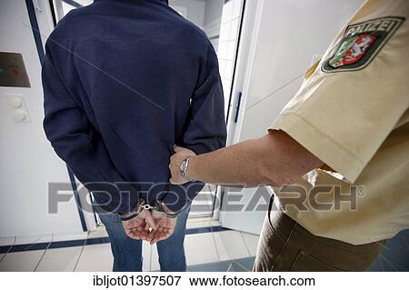 "A suspect being brought into a cell in police custody, re-enacted scene" View Large Photo Image Stock Photo - "A suspect being brought into a cell in police custody, re-enacted scene". Fotosearch
