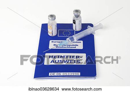 Picture - "A syringe and vials on an EU pet passport, Germany, Europe". Fotosearch