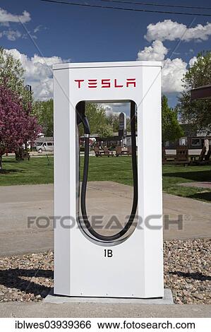 Stock Photograph - "A Tesla Supercharger in the parking lot of a motel, Lusk, Wyoming, United States, North America". Fotosearch