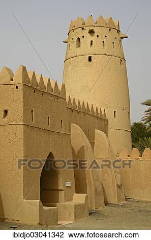 Stock Image - "A tower and walls, Al Jahili Fort, Al Ain, Abu Dhabi, United Arab Emirates, Asia". Fotosearch