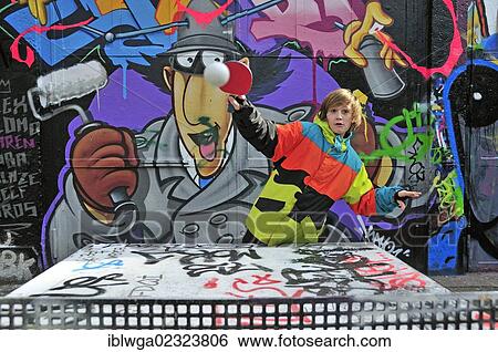 Stock Photograph - "A twelve-year-old boy playing table tennis, football area, Cologne, North Rhine-Westphalia, Germany, Europe, PublicGround, Europe". Fotosearch