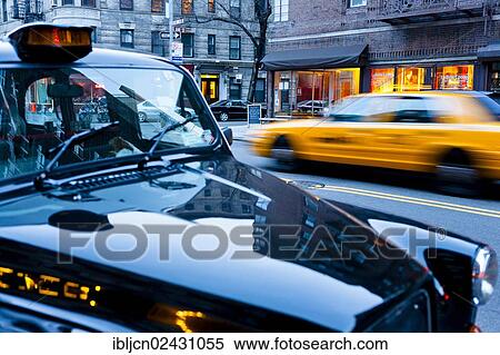 "A typical taxi driving through New York, a London taxi parked on the roadside, New York City, NY, USA" View Large Photo Image Stock Photography - "A typical taxi driving through New York, a London taxi parked on the roadside, New York City, NY, USA". Fotosearch
