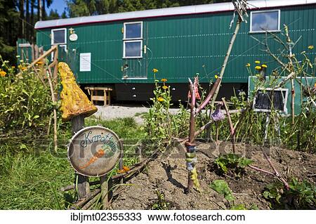 Stock Image - "A vegetable garden at the trailer which is used for playing and as a shelter, forest kindergarten, Ilmmuenster, Bavaria, Germany, Europe". Fotosearch