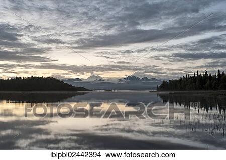 Picture - "A view of Mt Denali and Mt Hunter in the Alaska Range from Swan Lake, Alaska". Fotosearch
