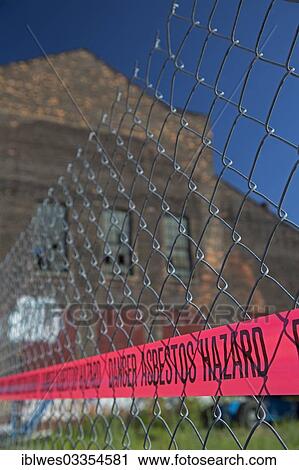 "A warning of an asbestos hazard at the old Globe Trading Company building, Detroit, Michigan, United States, North America" View Large Photo Image Stock Image - "A warning of an asbestos hazard at the old Globe Trading Company building, Detroit, Michigan, United States, North America". Fotosearch