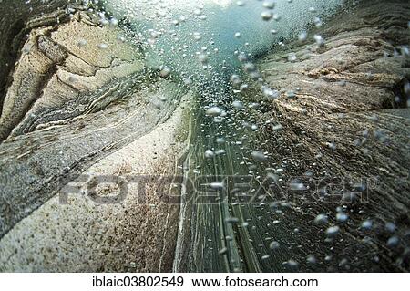 Stock Photo - "A waterfall seen from underwater, Verzasca River, Lavertezzo, Valle Verzasca valley, Canton of Ticino, Switzerland, Europe". Fotosearch