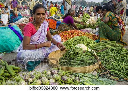 "A woman is selling vegetables at the weekly vegetable market, Nasik, Maharashtra, India, Asia" View Large Photo Image Stock Image - "A woman is selling vegetables at the weekly vegetable market, Nasik, Maharashtra, India, Asia". Fotosearch