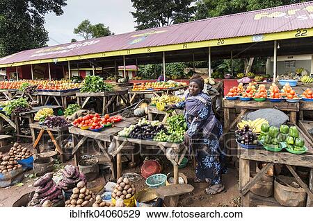 "A woman selling vegetables on a street market, Kampala, Uganda, Africa" View Large Photo Image Stock Photo - "A woman selling vegetables on a street market, Kampala, Uganda, Africa". Fotosearch