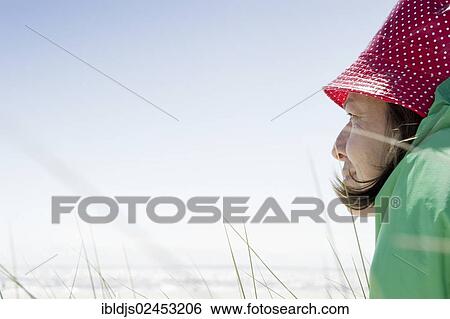 "A woman sitting on the beach, Sylt, Germany, Europe" View Large Photo Image Stock Photograph - "A woman sitting on the beach, Sylt, Germany, Europe". Fotosearch