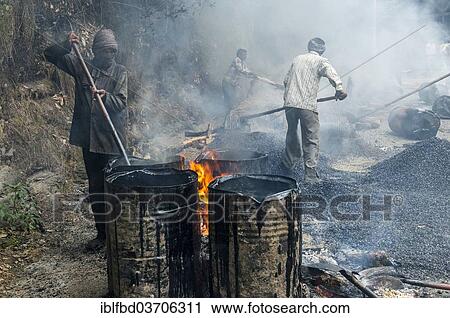 "A worker heating tar in barrels with an open fire at a road construction site, Shimla, Himachal Pradesh, India, Asia" View Large Photo Image Stock Image - "A worker heating tar in barrels with an open fire at a road construction site, Shimla, Himachal Pradesh, India, Asia". Fotosearch