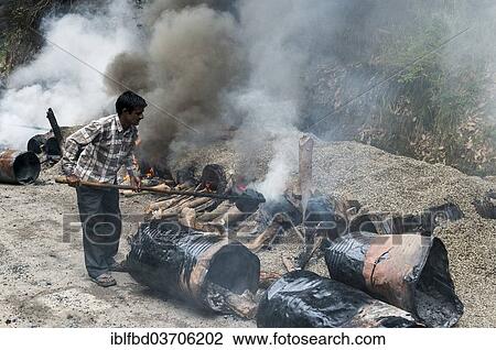 "A worker mixing gravel and hot tar on open fires at a road construction site, Shimla, Himachal Pradesh, India, Asia" View Large Photo Image Stock Image - "A worker mixing gravel and hot tar on open fires at a road construction site, Shimla, Himachal Pradesh, India, Asia". Fotosearch