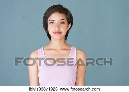 Stock Image - "A young confident woman, portrait". Fotosearch