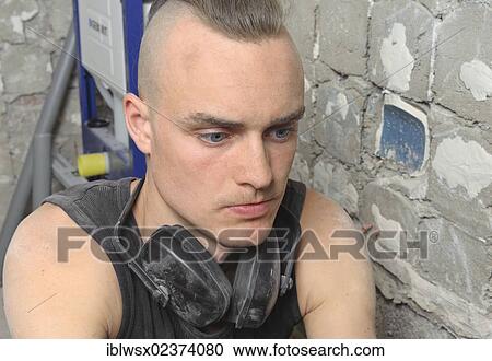"A young man with partly shaved head looking at the done work on a construction site, refurbishment, Baden-Wuerttemberg, Germany, Europe" View Large Photo Image Stock Image - "A young man with partly shaved head looking at the done work on a construction site, refurbishment, Baden-Wuerttemberg, Germany, Europe". Fotosearch