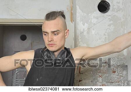 "A young man with partly shaved head looking at the done work on a construction site, refurbishment, Baden-Wuerttemberg, Germany, Europe" View Large Photo Image Stock Image - "A young man with partly shaved head looking at the done work on a construction site, refurbishment, Baden-Wuerttemberg, Germany, Europe". Fotosearch