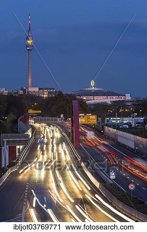 "A40 motorway or Ruhrschnellweg with the skyline of Dortmund, with Florian Tower and Westfalenhalle at the rear, Dortmund, North Rhine-Westphalia, Germany, Europe" View Large Photo Image Stock Image - "A40 motorway or Ruhrschnellweg with the skyline of Dortmund, with Florian Tower and Westfalenhalle at the rear, Dortmund, North Rhine-Westphalia, Germany, Europe". Fotosearch