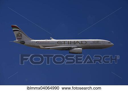 A6-EYK Etihad Airways Airbus A330-243 in flight against a blue sky View Large Photo Image Stock Image - A6-EYK Etihad Airways Airbus A330-243 in flight against a blue sky. Fotosearch