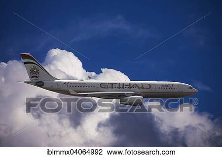 A6-EYK Etihad Airways Airbus A330-243 in flight against a cloudy sky View Large Photo Image Stock Image - A6-EYK Etihad Airways Airbus A330-243 in flight against a cloudy sky. Fotosearch