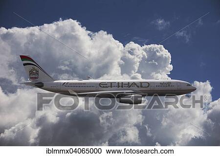 A6-EYK Etihad Airways Airbus A330-243 in flight against a cloudy sky View Large Photo Image Stock Image - A6-EYK Etihad Airways Airbus A330-243 in flight against a cloudy sky. Fotosearch