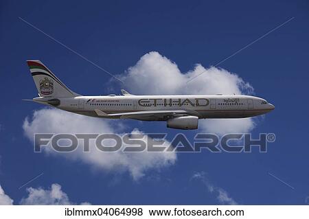A6-EYK Etihad Airways Airbus A330-243 in flight against a cloudy sky View Large Photo Image Stock Photo - A6-EYK Etihad Airways Airbus A330-243 in flight against a cloudy sky. Fotosearch