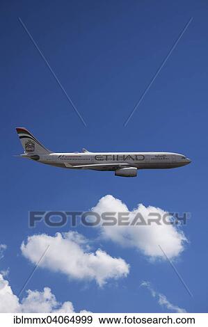 A6-EYK Etihad Airways Airbus A330-243 in flight against a cloudy sky View Large Photo Image Stock Photo - A6-EYK Etihad Airways Airbus A330-243 in flight against a cloudy sky. Fotosearch