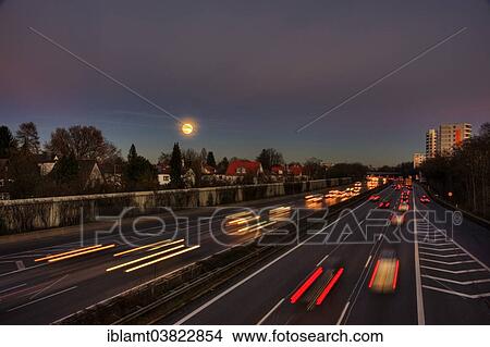 "A96 motorway at dusk with light trails of moving cars, Munich, Bavaria, Germany, Europe" View Large Photo Image Picture - "A96 motorway at dusk with light trails of moving cars, Munich, Bavaria, Germany, Europe". Fotosearch