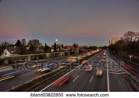 "A96 motorway at dusk with light trails of moving cars, Munich, Bavaria, Germany, Europe" View Large Photo Image Stock Image - "A96 motorway at dusk with light trails of moving cars, Munich, Bavaria, Germany, Europe". Fotosearch