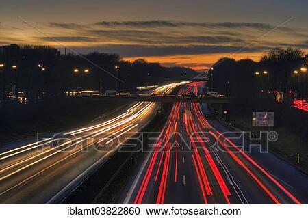 "A96 motorway at dusk with light trails of moving cars, Munich, Bavaria, Germany, Europe" View Large Photo Image Stock Image - "A96 motorway at dusk with light trails of moving cars, Munich, Bavaria, Germany, Europe". Fotosearch