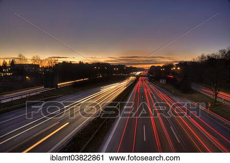 "A96 motorway at dusk with light trails of moving cars, Munich, Bavaria, Germany, Europe" View Large Photo Image Stock Image - "A96 motorway at dusk with light trails of moving cars, Munich, Bavaria, Germany, Europe". Fotosearch