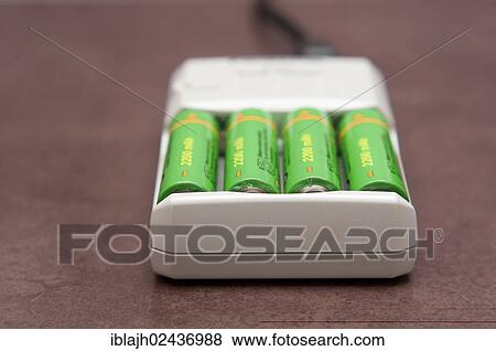 AA rechargable batteries charging in a mains electricity charger View Large Photo Image Stock Photo - AA rechargable batteries charging in a mains electricity charger. Fotosearch