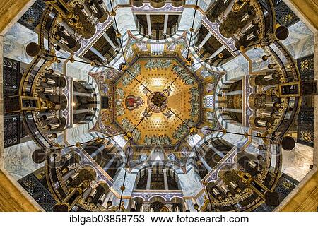 Stock Image - "Aachen Cathedral cupola and Barbarossa's Chandelier, Unesco World Heritage Site, Aachen, North Rhine-Westphalia, Germany, Europe". Fotosearch