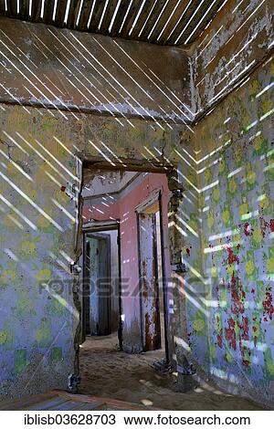 Stock Image - "Abandoned building in the former diamond mining town, now a ghost town, Kolmanskop, Luderitz, Karas Region, Namibia, Africa". Fotosearch