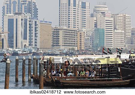 Abra, traditional water taxi on Dubai Creek, between Deira and Bur Dubai, Dubai, United Arab Emirates, Middle East, Asia View Large Photo Image Stock Image - Abra, traditional water taxi on Dubai Creek, between Deira and Bur Dubai, Dubai, United Arab Emirates, Middle East, Asia. Fotosearch
